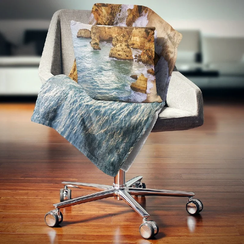 Recycled polyester blankets for an eco - conscious optionRecycled polyester blankets for an eco - conscious optionDesignart 'Golden Rocks and Beach at Algarve' Seashore Throw Blanket