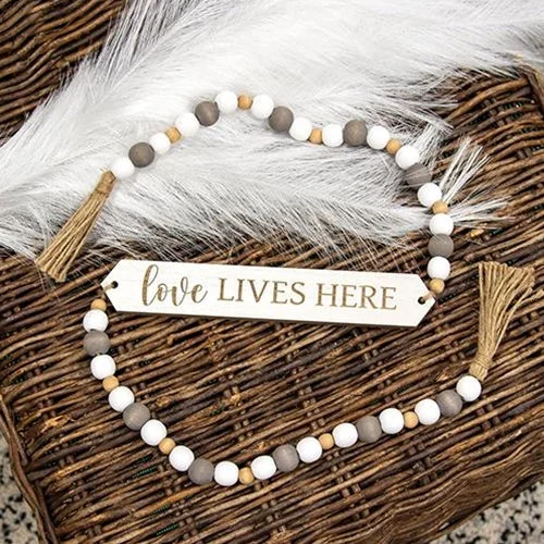Bed skirts with a eco - friendly materialLove Lives Here Beaded Banner