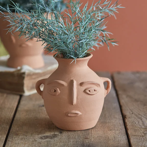 Bed skirts with a modern art - inspired printAbstract Face Terra Cotta Jug
